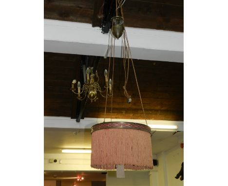 An early 20th century counter-balance anular light, with a brass ring and weight, fitted with a brick coloured fringe. D. 43c