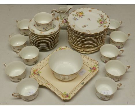 A late 19th century French tea service, decorated with sprays of flowers within gilt borders, bears CFH GDM France to base, t