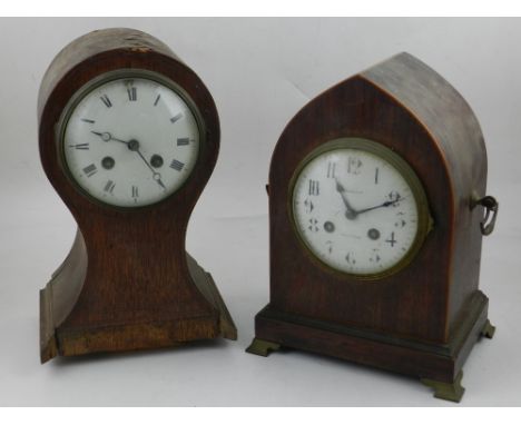 An Edwardian rosewood cased mantel clock with lancet arched case, the eight day French movement striking on a gong, the circu