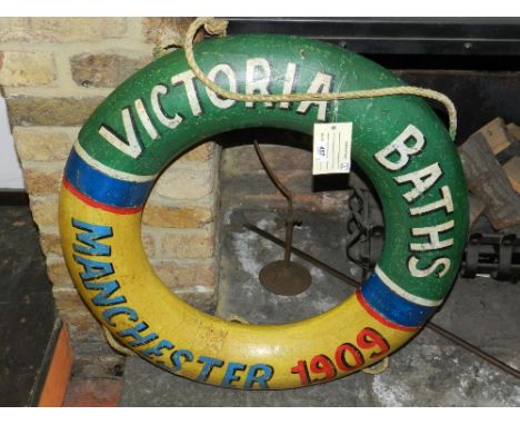 A decorative vintage style painted life ring.