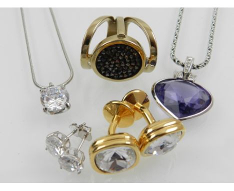 A pair of gilt metal and Swarovski crystal cufflinks, together with a Swarovski purple crystal and silver heart-shaped pendan