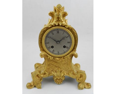 A late 19th / early 20th century French gilt metal mantel clock, eight day movement, striking bell, the silvered dial with Ro