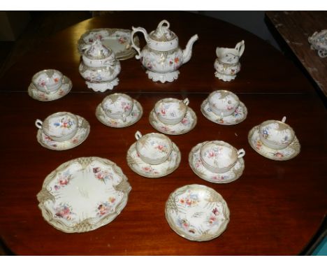 A mid 19th century porcelain tea service, having gilt and floral decoration. 