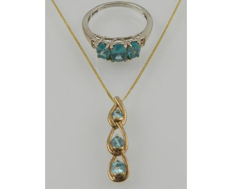 A 9 carat white gold and three stone apatite ring, together with a 9 carat yellow gold and apatite triple drop pendant, suspe