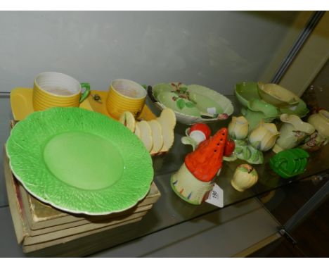 A Carltonware sugar sifter, modelled in the form of a cottage, together with two toast racks, a cruet set and sundry items (q