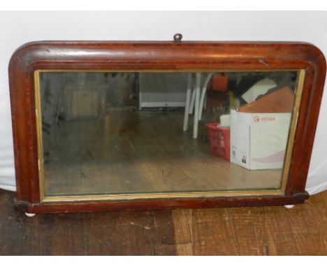 A late Victorian over mantle mirror, together with a print of Winston Churchill and two others.