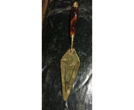 Nine carat gold trowel bookmark.