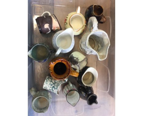 A collection of small ceramic jugs x13.
