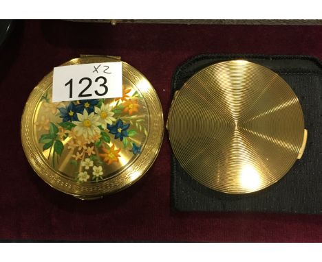 Two vintage compacts, as new.