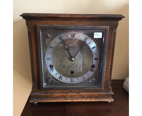 Oak cased mantle clock by Elliott London retailed by Carmichaels Hull 3 train movement striking on gongs with night silent me