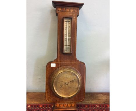Unusual inlaid mahogany aneroid banjo barometer.