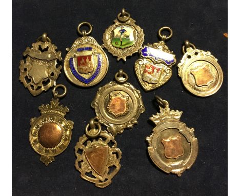 Nine silver football medals from Cliff Britton's junior career inc. enamel of football player