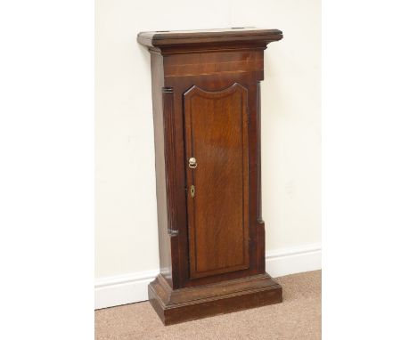 19th century oak and mahogany longcase clock trunk cupboard enclosed by single door, hinged compartment to the top, fluted qu