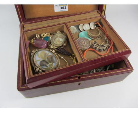 Liberty tooled leather case containing 1920s circular diamond brooch with interchangeable engine turned enamel discs, Victori