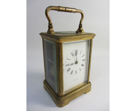 Early 20th century brass cased carriage clock, enamel dial signed W & J Milne Edinburgh, repeating movement striking on the h