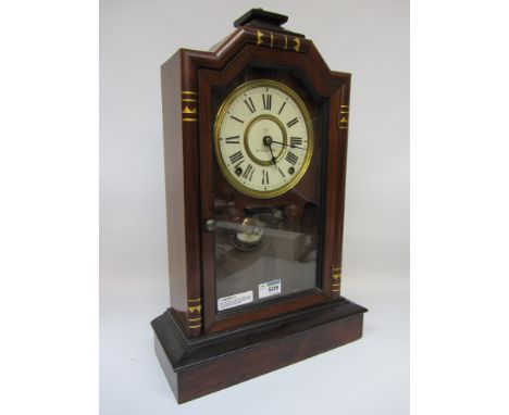 Late 19th century American mantle clock in rosewood case, painted enamel dial dated 1878, with striking movement and a mahoga