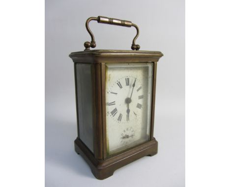 Early 20th century brass cased carriage clock, alarm movement striking on bell, bevelled glass to front and sides, H14cm over