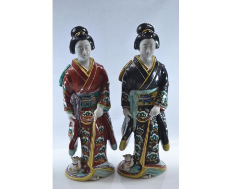 Two Japanese Kutani ceramic figures of Biyin,  H36cmSmall areas of flaking to black paint. Loss to one cat ear to figure in b