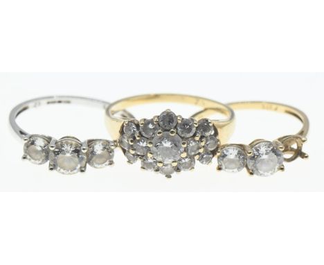 Three 9ct gold rings set with CZ, sizes K-M, gross weight 5.21 grams, one stone missing 