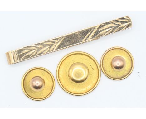 Three 9ct gold buttons and a 9ct gold tie clip, gross weight 3.6 grams 