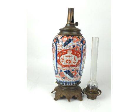 Japanese Kutani ceramic & brass oil lamp H66cm Chip to top of glass. Body with what appears to be a firing flaw near rim and 