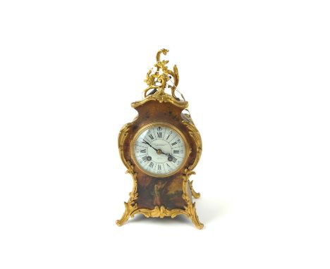 A Vernis Martin style mantle clock, painted with a figure in a landscape and floral sprays, foliate gilt metal mounts, white 