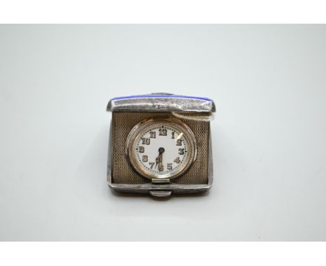 Silver and blue enamel mounted travel clock, John William Barrett, Birmingham 1936, 5 x 4.5cm Enamel loss to cover. Chip to e
