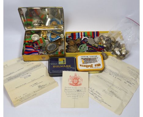 A collection of mostly unnamed WWI and WWII medals, cap badges and buttons, one pair named 24835 PTE. A. PRICE. R. W. KENT. R
