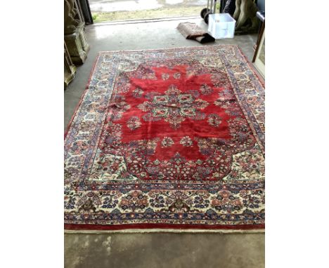 A North West Persian red ground carpet, 360 x 270cm