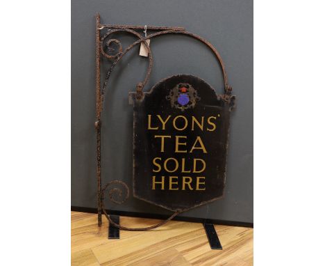 A wrought iron and enamel ‘Lyon’s’ tea sold here’ advertising sign, 92cm high