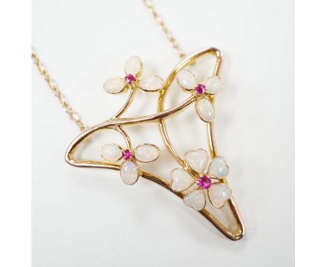 A yellow metal ruby and white opal set Art Nouveau style necklace, in Carrington &amp; Co. box, 4cm