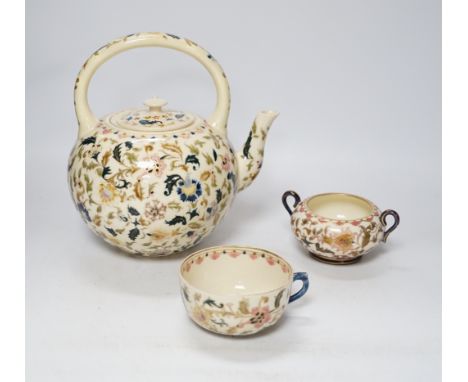 A Zsolnay teapot, teacup and sugar bowl, tallest 22cm