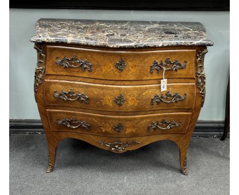 A Louis XVI style gilt metal mounted inlaid kingwood marble topped serpentine bombe commode, width 106cm, depth 49cm, height 