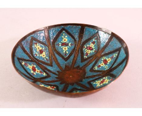 A GOOD SYRIAN ENAMEL BOWL, with floral decoration and a turquoise ground, 14cm