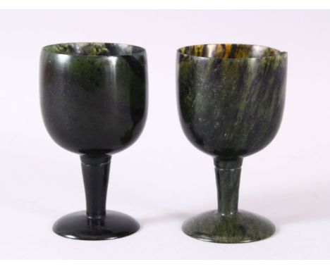 A GOOD PAIR OF MUGHAL CARVED SPINACH GREEN JADE GOBLETS, 10cm high X 5.6cm diameter.