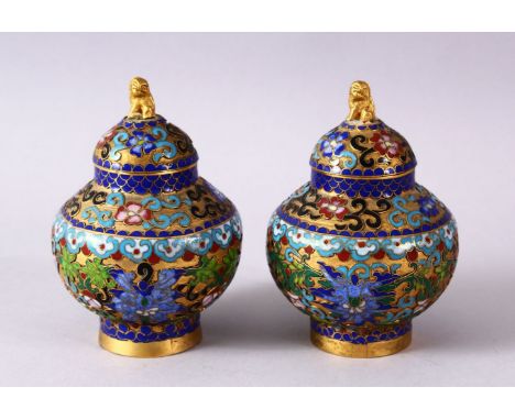 A PAIR CHINESE CLOISONNE JAR &amp; COVERS, each decorated in similar style with raised enamel decoration depicting lotus flor