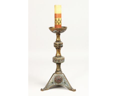 AN EARLY ORIENTAL CHAMPLEVE ENAMEL CANDLESTICK, 12ins high.
