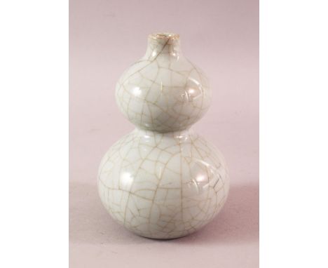 A 19TH / 20TH CENTURY CHINESE CRACKLE GROUND CELADON DOUBLE GOURD PORCELAIN VASE, the base with a six character qianlong mark