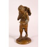 A SMALL JAPANESE/ORIENTAL BRONZE FIGURE OF A TRAVELLING MAN, 14cm high.