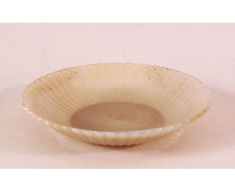 A FINE INDIAN CARVED WHITE JADE PETAL FORMED DISH, with ribbed body to simulate petal, 13cm diameter.