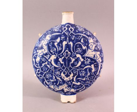 A TURKISH IZNIK BLUE &amp; WHITE POTTERY WATER FLASK, with floral decoration, 23cm