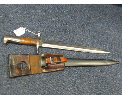 Bayonet: An extremely good Swiss Model 1918 bayonet in its blued steel scabbard with correct frog. Mint blade marked 'ELSENER