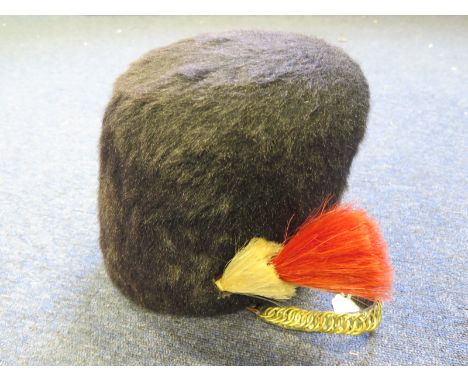 British Army Bearskin with red & white plume. Grenadier Guards badge to front. With 8 tab liner. Age not known. Viewing recom