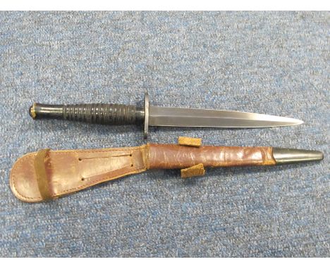 WW2 era Commando style RAF Escape dagger with wooden black ribbed handle, with leather scabbard. Blade blackened, no makers m