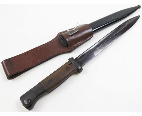 Austrian ? K98 Bayonet with metal scabbard and brown leather frog. Wooden grips. Frog stamped 'SS 1940'. 