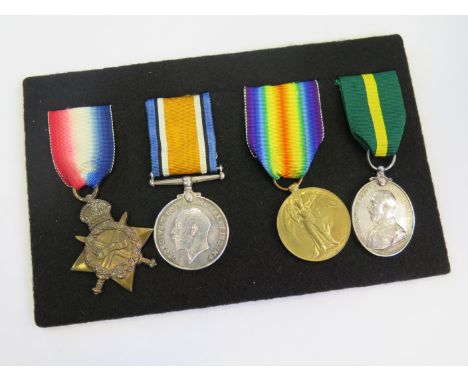 1915 Star Trio (1225 Pte A F Robertson Middlesex Regt), (Sjt on Pair), and GV Territorial Force Efficiency Medal (200034 Sjt 