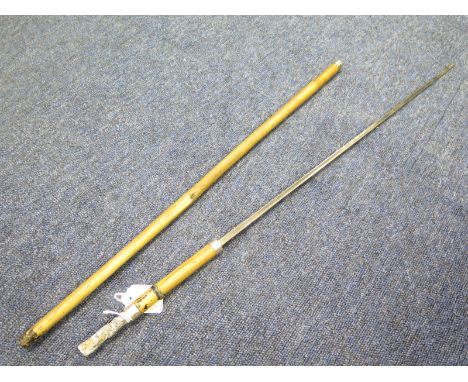 Victorian Swordstick made from cane with hallmarked silver ferrule. Good trefoil blade 21" with fullers. Handle present but p