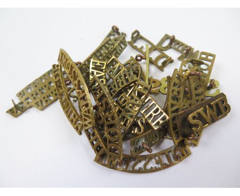Badges a selection of brass Shoulder Titles all later types in smaller size inc Army Apprentice School.20x