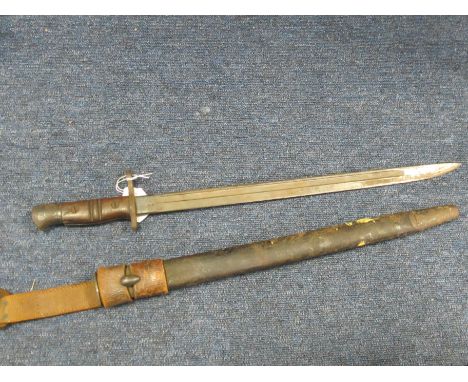 Bayonet: A British Home Guard pattern 1913 sword bayonet made by Remington in May 1917. In its steel mounted leather scabbard