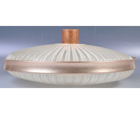 A stunning original 20th Century retro vintage plastic and copper ceiling light lamp of textured form having a fluted two sec